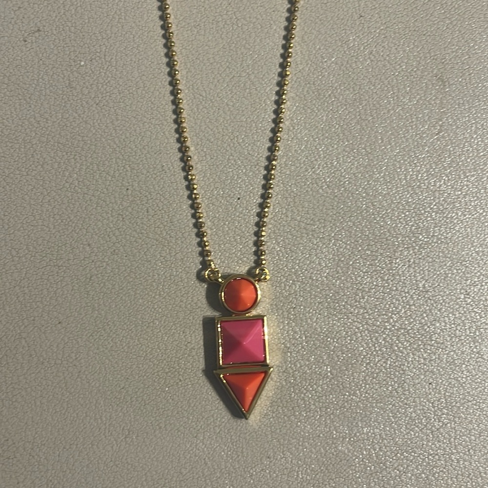 Trina Turk geometric orange and pink pendant necklace